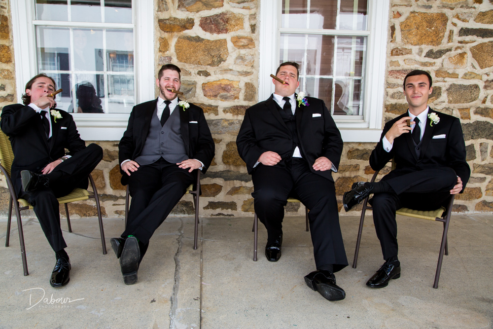 Grooms men relax before the ceremony